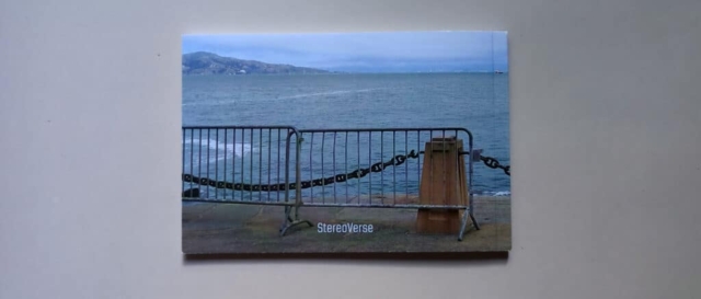 Back cover of The Vertigo Tour featuring view of the San Francisco bay obstructed by a temporary gate and the Stereoverse logo