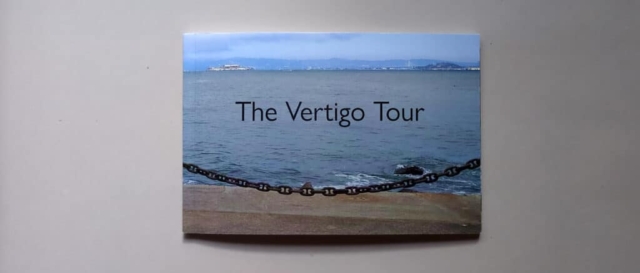 Cover of The Vertigo Tour featuring a view of the San Francisco Bay obstructed by a heavy chain.